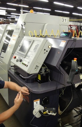 SFA Technician at Work on CNC SFA Technician at Work on CNC